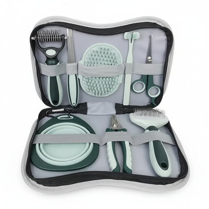 Set of grooming tools for pets in a travel case on a white background
