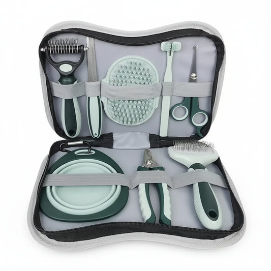 Set of grooming tools for pets in a travel case on a white background