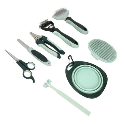 Set of pet grooming tools including scissors, brush, and nail clippers on a white background